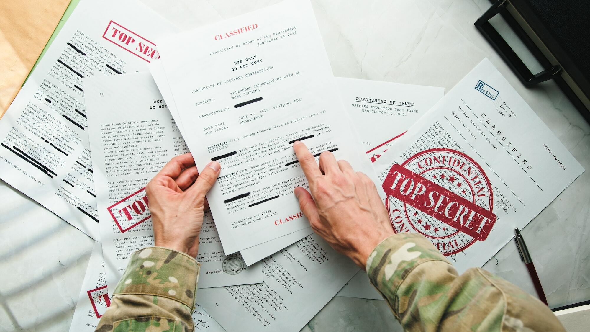 Soldier Reads Secret Documents.