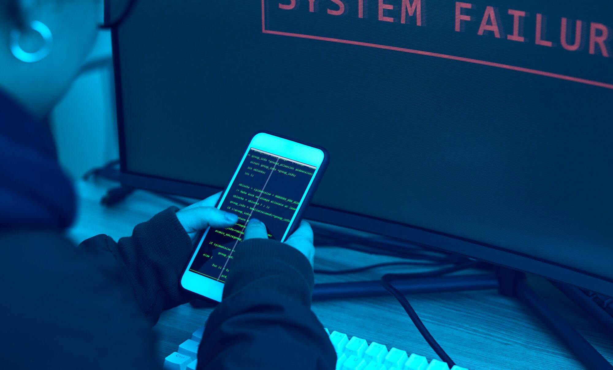 Phone screen, code and hacker hands for cybersecurity, information technology and phishing fail or